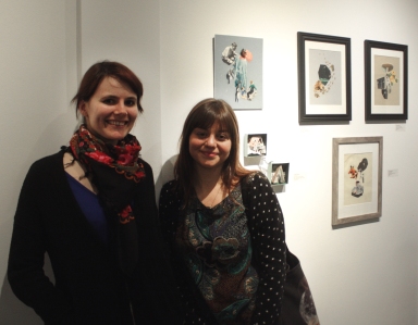 Dina Shaposhnikova and Lindsey Boss in front of Lindsey's collage series